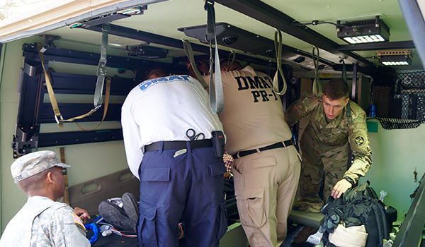 NDMS team working on a patient  on an ambulance