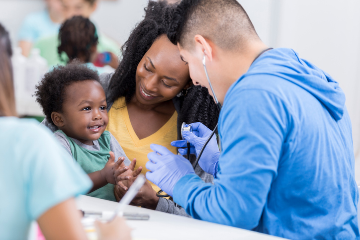 doctor and pediatric patient with parent