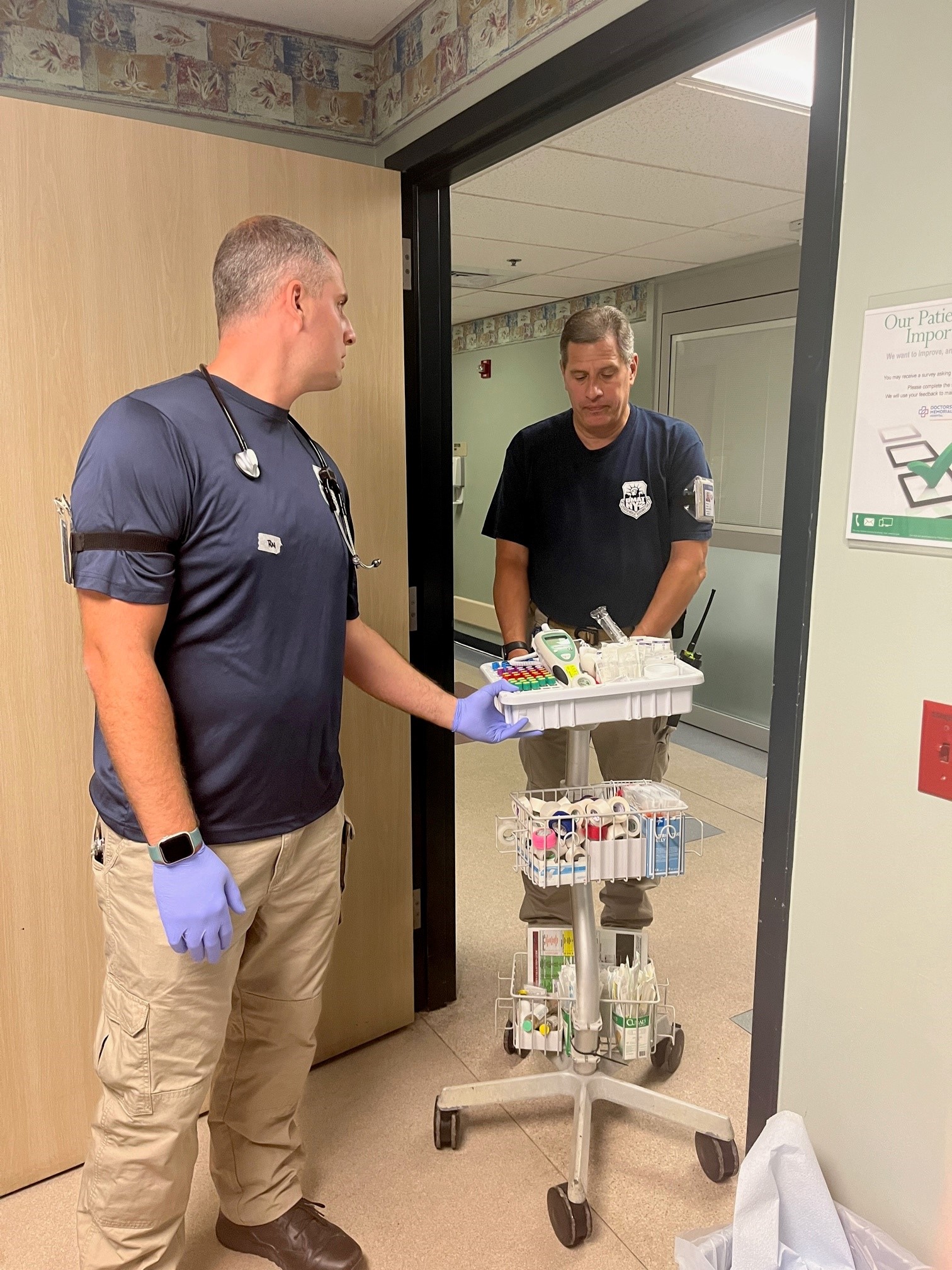 Photo of Scott Kress (left) and his father,  Steve Kress (right) providiing support at a hospital